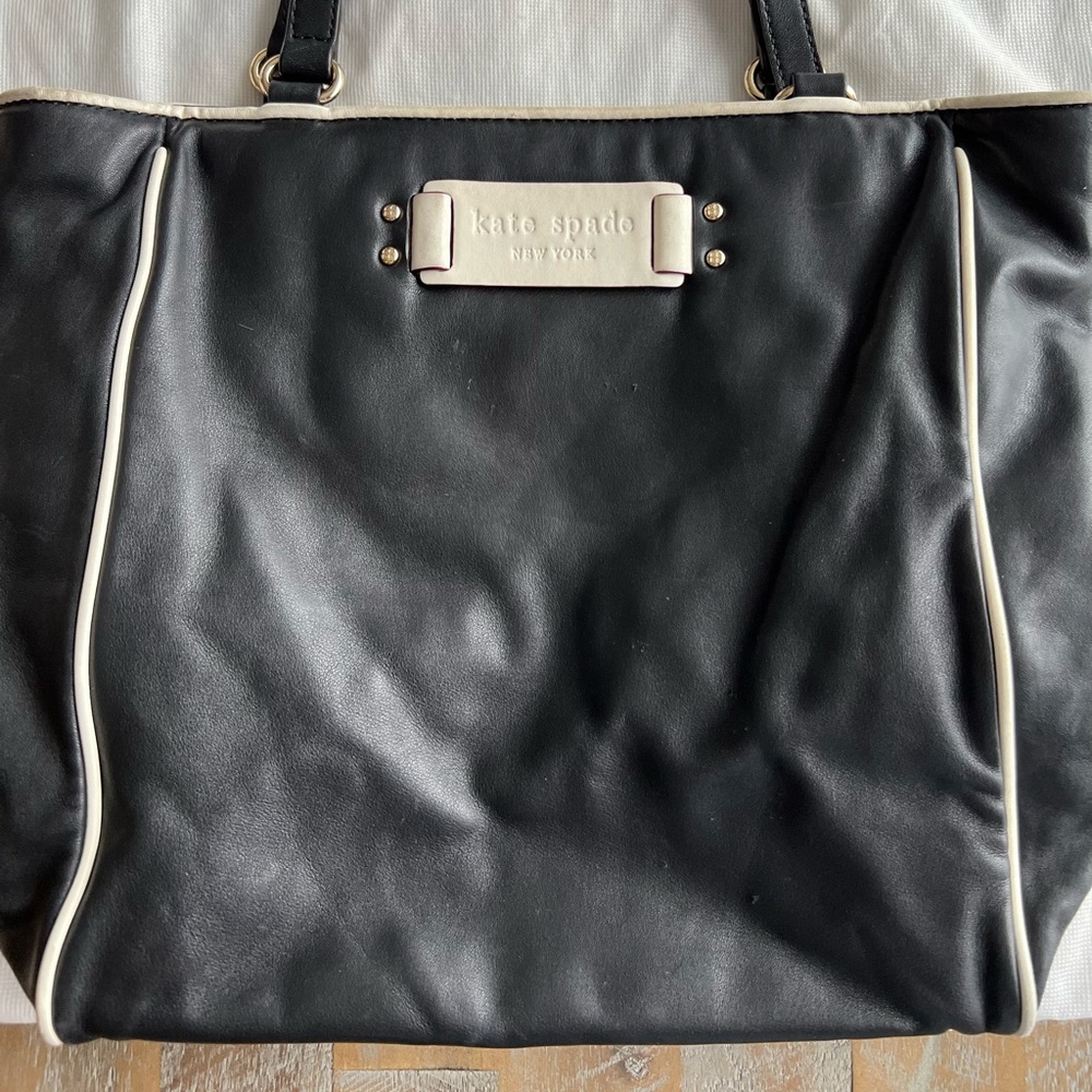 Kate Spade black handbag with white piping.